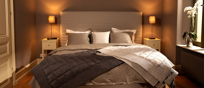 Set the scene for box spring beds: Make the bedroom lighting atmospheric